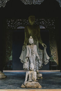 Statue of buddha against building