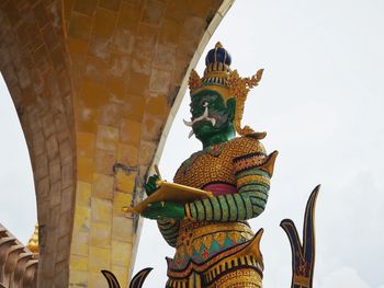 Low angle view of statue against building