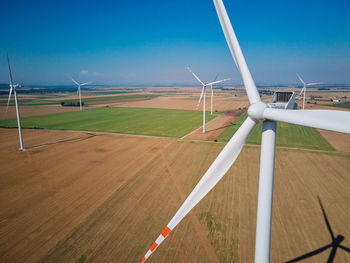 Aerial view of wind turbine in countryside area, wind power plants in agricultural landscape