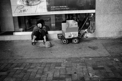 Full length of boy on street in city