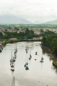 High angle view of boats in river against sky