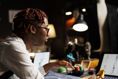 Side view of business colleagues working at office