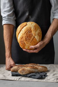 Midsection of man preparing food