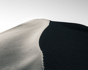 Scenic view of desert against clear sky