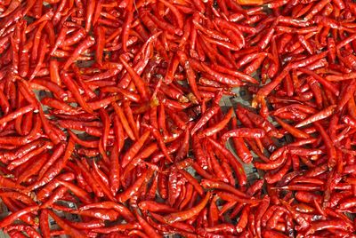 Full frame shot of red chili peppers for sale at market stall