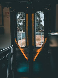 View of building through train window