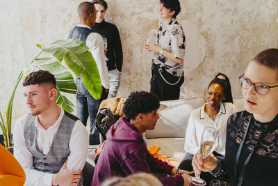 Multiracial business colleagues discussing during event