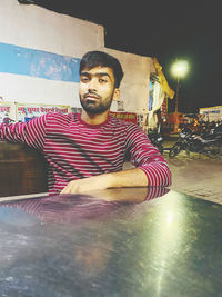 Portrait of young man looking at camera