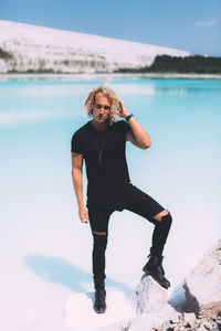 Portrait of man standing on beach