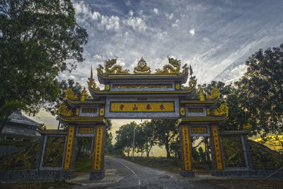 View of temple against cloudy sky