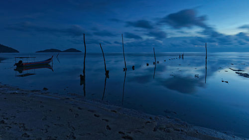 Scenic view of beach against sky during winter