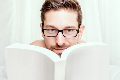 Close-up of young woman using laptop at home
