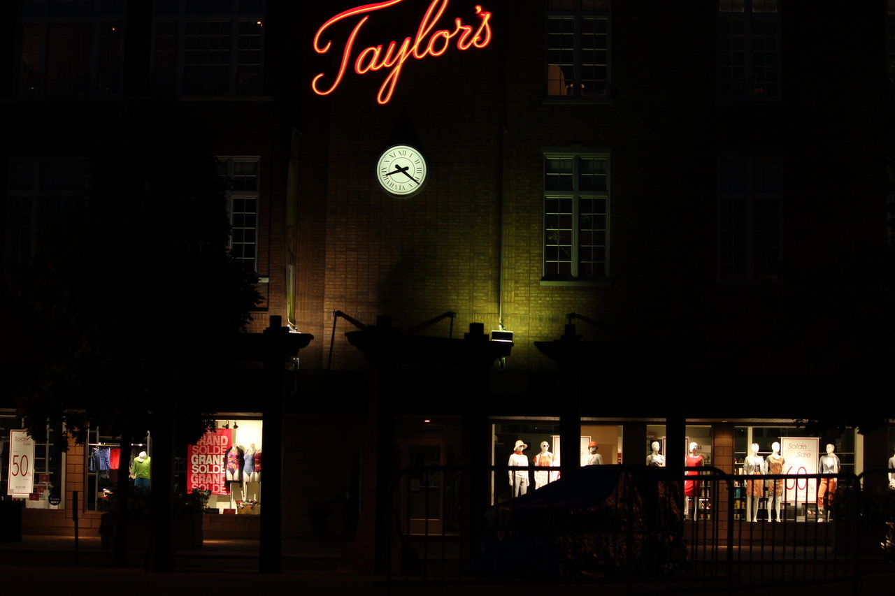 building exterior, architecture, built structure, text, night, illuminated, western script, communication, city, sign, non-western script, building, street, information sign, outdoors, road sign, window, lighting equipment, city life, low angle view