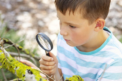 Close-up of boy holding racket