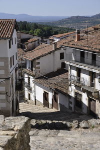 High angle view of residential buildings against sky