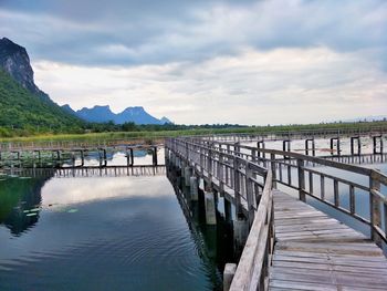 Pier over lake against sky