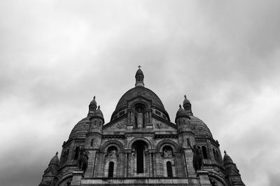 Low angle view of cathedral against cloudy sky