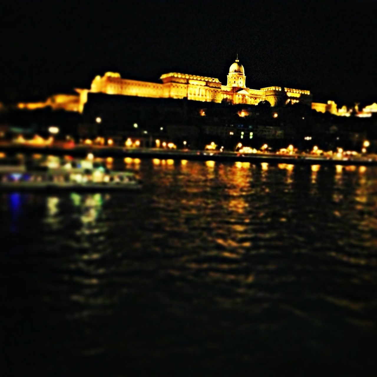 building exterior, architecture, night, illuminated, built structure, water, waterfront, reflection, river, city, religion, place of worship, church, travel destinations, spirituality, famous place, history, outdoors, sky