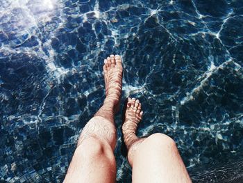 Low section of woman in water