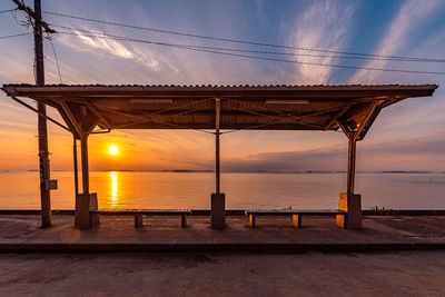 Scenic view of sea against orange sky