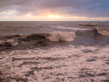 Scenic view of sea against dramatic sky