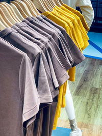 Tilt image of clothes hanging on rack at store