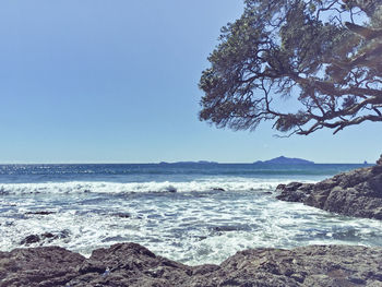 View of calm blue sea against clear sky