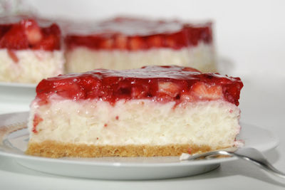 Close-up of strawberry cake in plate on table