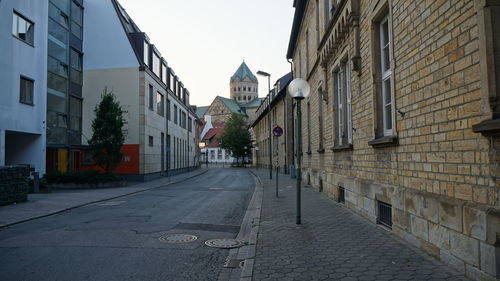 Street amidst buildings against sky