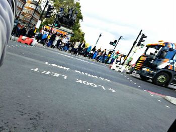 People on road against sky