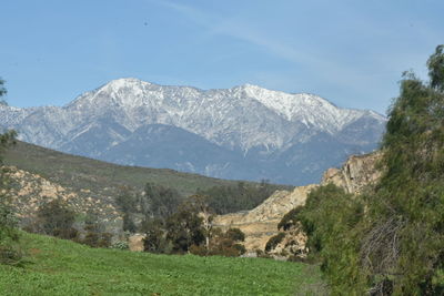 Scenic view of landscape and mountains against sky