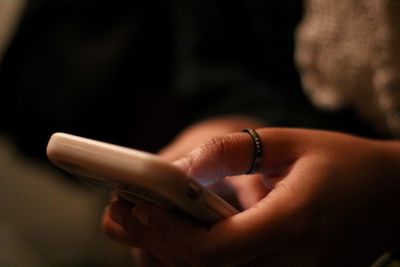 Close-up of woman using phone