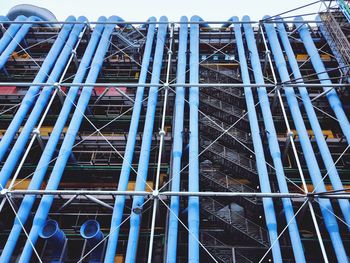 Low angle view of construction site against building