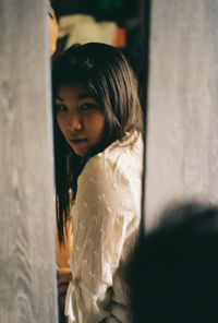 Portrait of young woman looking away