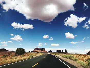 Road amidst landscape against sky