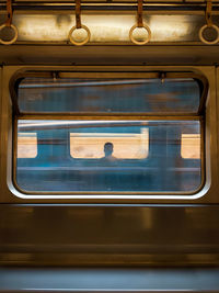 Man seen through train window