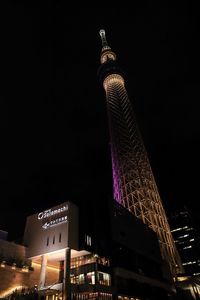 Low angle view of modern building at night