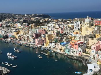 High angle view of townscape by sea