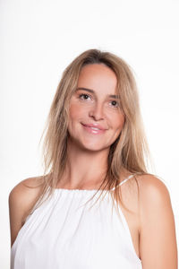 Portrait of a smiling young woman over white background