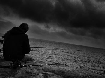 Scenic view of sea against cloudy sky