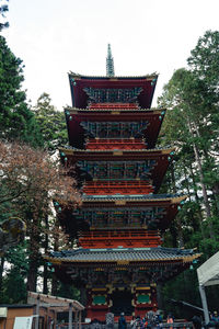 Low angle view of pagoda against building