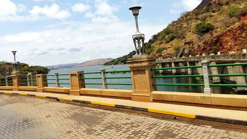 Street against mountain range and clouds