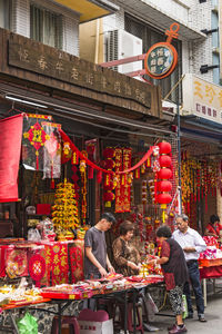 People at market stall