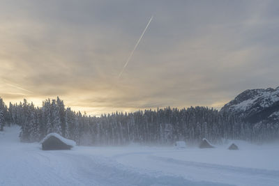Scenic view of snow covered mountains against sky