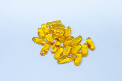 Close-up of yellow leaf on white background