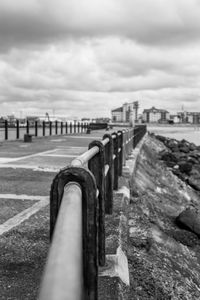 Close-up of bridge against sky in city