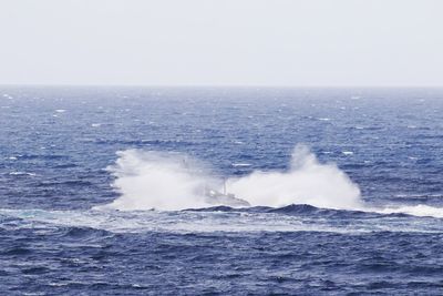 Boat in sea against sky