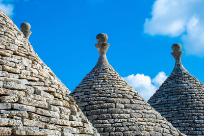 Low angle view of building against blue sky