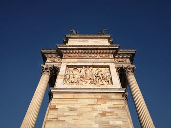 Low angle view of historical building against blue sky