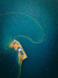 High angle view of ship sailing in sea